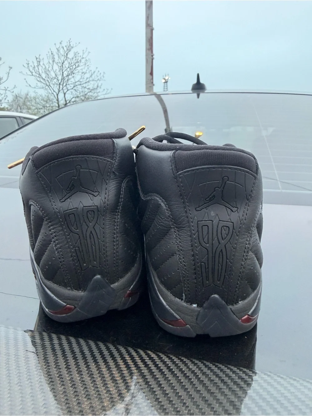 Men's Black Jordan’s Athletic Sneakers with Gold Accents